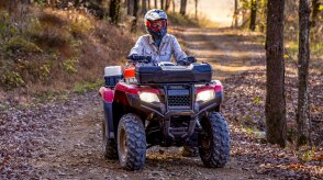 Front view of Driver on Rancher in woods.