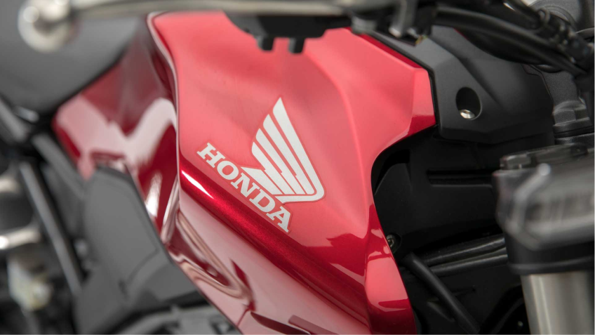 A Honda logo on the side of a motorcycle