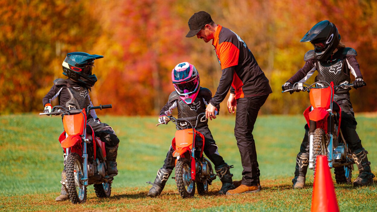 Instructor teaching Junior Red Rider how to take off