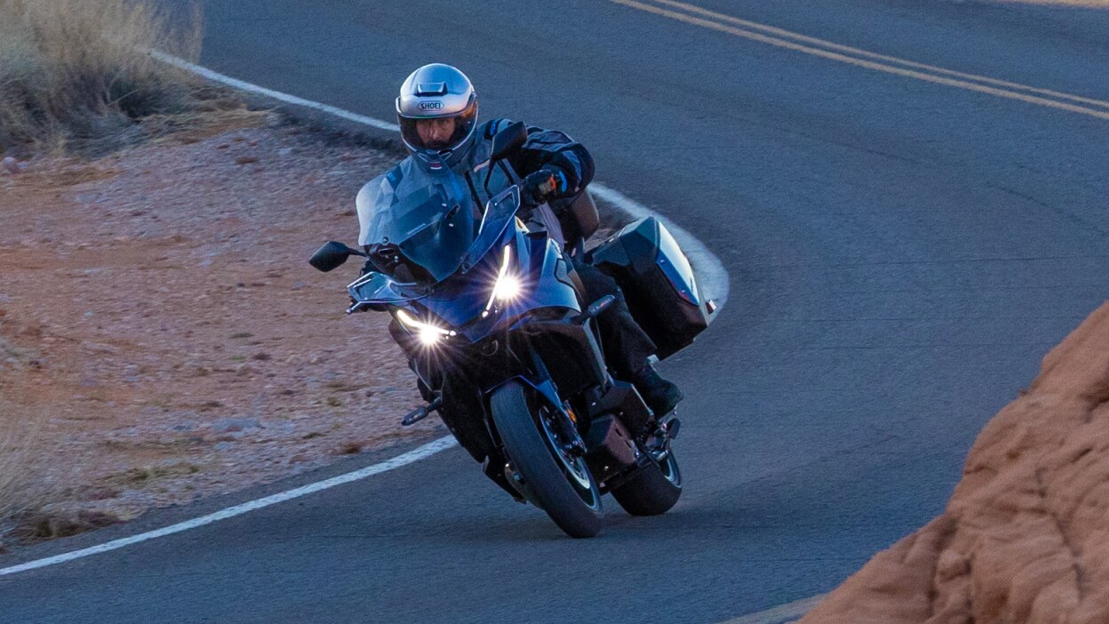 Rider turning right on road on NT1100.