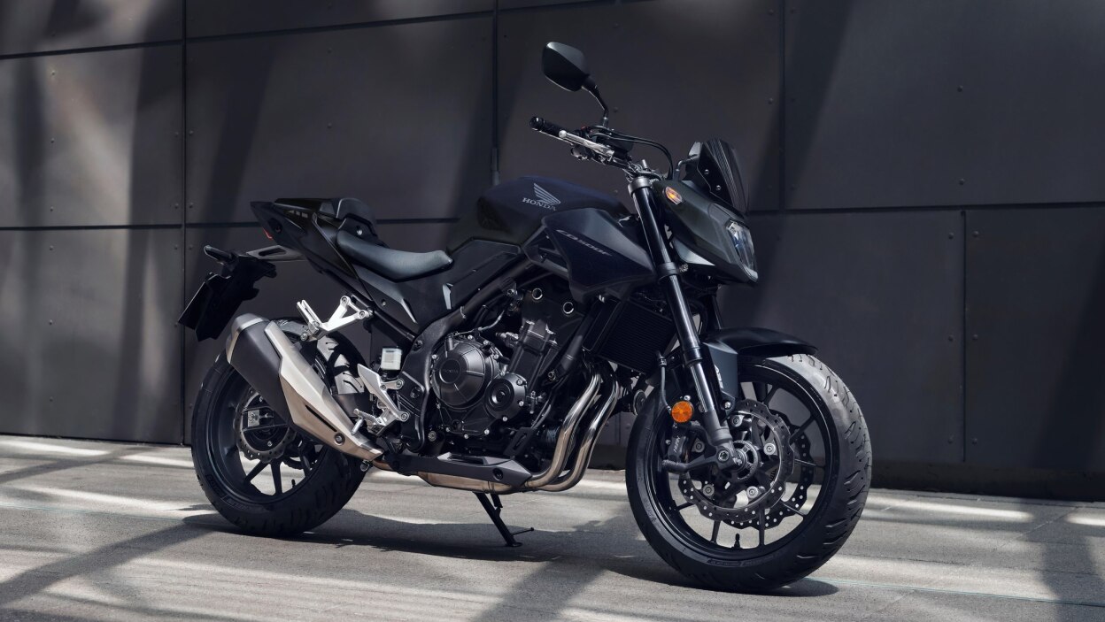 CB500F stationary in grey concrete landscape.